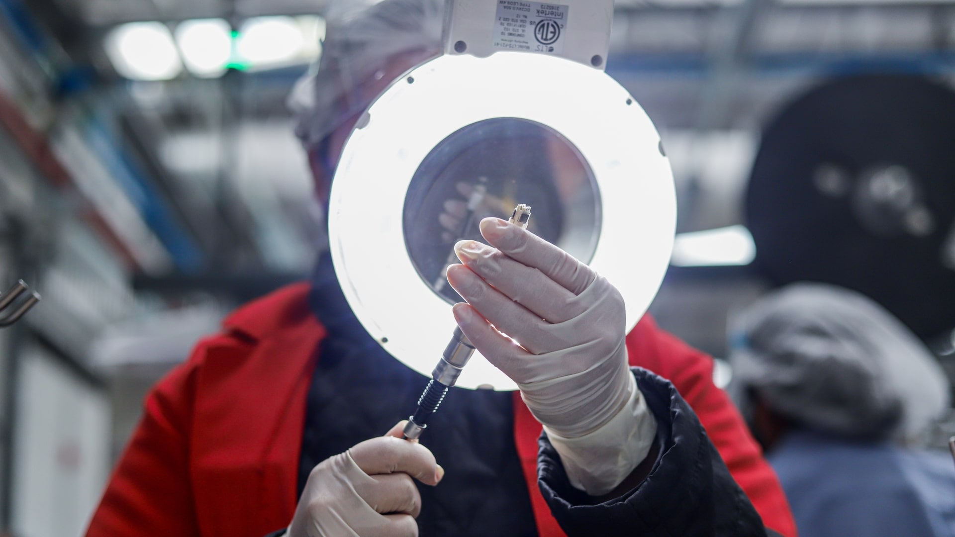 About us – cutting edge, customized for you-min Person in EV parts factory